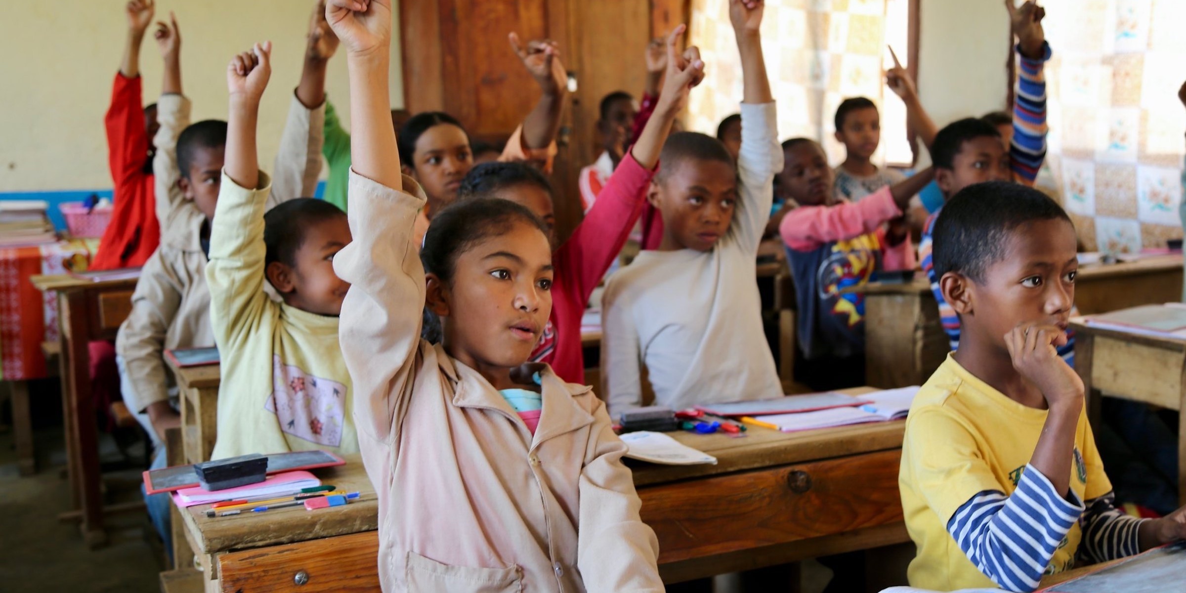 "Students raise their hand at the Anosisoa public school. Madagascar 2016. Credit: GPE/Carine Durand